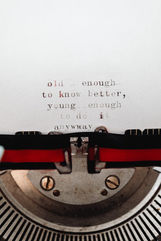 Close-up of a typewriter with an inspirational quote emphasizing youthful spirit and wisdom.